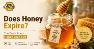 A jar of golden honey next to a honey dipper, featuring the article title "Does Honey Expire? The Truth About Honey Shelf Life" and the Little Honey logo.