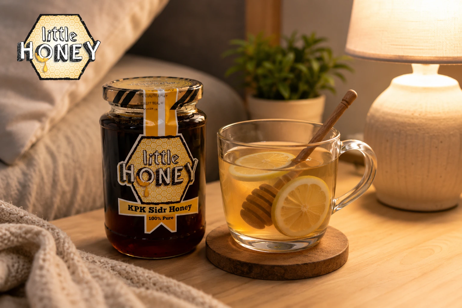 A glass mug of warm honey lemon tea with a wooden dipper inside, sitting next to a jar of Little Honey Sidr Honey on a cozy wooden table.