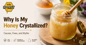 A jar of Little Honey pure natural honey next to a bowl of fresh crystallized honey and a wooden honey dipper, showcasing the natural crystallization process of pure honey.