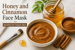 Bowl of natural mixture with cinnamon sticks for a DIY honey and cinnamon face mask.